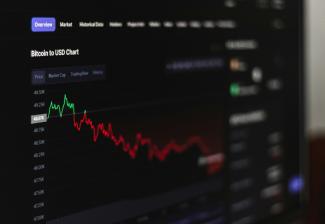 a computer screen displaying a stock market chart by Behnam Norouzi courtesy of Unsplash.
